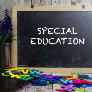 Blackboard with "SPECIAL EDUCATION" written, surrounded by colorful letters.