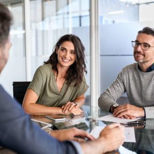 Mature couple meeting financial advisor for investment