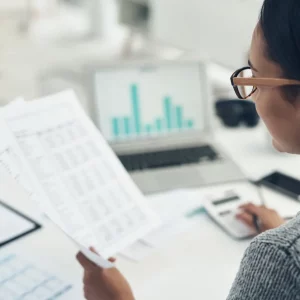 Woman reading the stats of a school and doing internal audit for it
