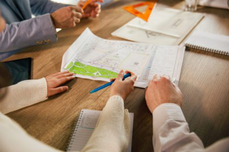 Architects or planners collaborating on school building designs