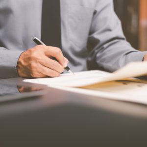 Businessman validates and manages business documents and agreements. , signing a business contract approval of contract documents confirmation or warranty certificate,employment idea, project review