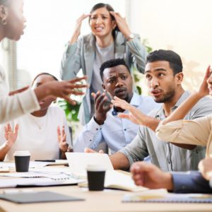 Cropped shot of a diverse group of businesspeople arguing during a meeting in the boardroom